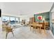 Open-plan living room with seating area, dining area, balcony, and tile floors at 400 Island Way # 1404, Clearwater Beach, FL 33767