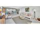 Inviting open-concept living space with a view of the modern kitchen and comfortable seating at 400 Island Way # 1404, Clearwater Beach, FL 33767