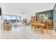 Bright living room featuring tile floors, comfortable seating, and sliding glass doors to a balcony with a stunning view at 400 Island Way # 1404, Clearwater Beach, FL 33767