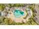 Overhead view of an unique pool and spa area surrounded by tropical foliage at 400 Island Way # 1404, Clearwater Beach, FL 33767
