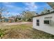 Spacious backyard with a large cleared area, perfect for adding a pool or other outdoor features at 40242 Sunburst Dr, Dade City, FL 33525