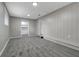 Spacious basement room with gray walls and carpet at 40242 Sunburst Dr, Dade City, FL 33525