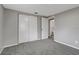 Bedroom with gray walls, carpet, and a large closet at 40242 Sunburst Dr, Dade City, FL 33525