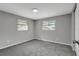 Simple bedroom with gray walls and carpet flooring at 40242 Sunburst Dr, Dade City, FL 33525