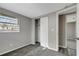 Bedroom with gray walls, carpet, and access to another room at 40242 Sunburst Dr, Dade City, FL 33525