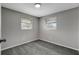 Simple bedroom with gray walls and carpet flooring at 40242 Sunburst Dr, Dade City, FL 33525