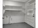 Laundry room with shelving and updated plumbing at 40242 Sunburst Dr, Dade City, FL 33525