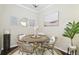 Charming dining room with round table and wicker chairs at 501 Knights Run Ave # 2214, Tampa, FL 33602