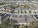 Aerial view of a residential community with lush landscaping and a sparkling community pool at 5038 White Sanderling Ct, Tampa, FL 33619