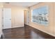 Bright bedroom featuring hardwood floors, a large window and neutral paint at 5038 White Sanderling Ct, Tampa, FL 33619