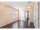 Bright bedroom featuring laminate wood floors and ample natural light at 5038 White Sanderling Ct, Tampa, FL 33619