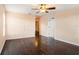Bright bedroom with hardwood floors and a ceiling fan; door provides easy access at 5038 White Sanderling Ct, Tampa, FL 33619