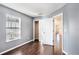 Well-lit bedroom with hardwood floors, closet, and easy access to other rooms at 5038 White Sanderling Ct, Tampa, FL 33619