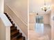 Stairway and kitchen combo shot showcasing the tile floors and natural light at 5038 White Sanderling Ct, Tampa, FL 33619