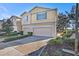 Inviting two-story home with a well-maintained lawn and attached two-car garage at 5038 White Sanderling Ct, Tampa, FL 33619