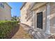Charming home featuring a covered entrance with classic column accents and landscaped pathway at 5038 White Sanderling Ct, Tampa, FL 33619