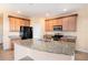 Modern kitchen with granite countertops, stainless steel appliances, and a center island at 5038 White Sanderling Ct, Tampa, FL 33619