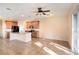 Open concept kitchen and living space with tile floors, island, and modern appliances at 5038 White Sanderling Ct, Tampa, FL 33619