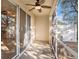 Screened patio offers outdoor living space with a ceiling fan and views of the yard at 5038 White Sanderling Ct, Tampa, FL 33619