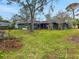 Large backyard with mature trees and grass at 5225 Venetian Ne Blvd, St Petersburg, FL 33703