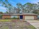 Brick ranch house with attached garage and large yard at 5225 Venetian Ne Blvd, St Petersburg, FL 33703