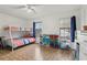 Bedroom with bunk beds, storage, and window at 5328 Ridgewell Ct, Tampa, FL 33624