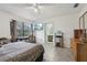 Bedroom with large window, ceiling fan and en-suite bathroom at 5328 Ridgewell Ct, Tampa, FL 33624