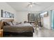 Bedroom with large window, ceiling fan and wood dresser at 5328 Ridgewell Ct, Tampa, FL 33624