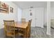 View of cozy dining area with wood table and four chairs at 5328 Ridgewell Ct, Tampa, FL 33624