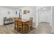View of the dining area with wood table and chairs, open to living room at 5328 Ridgewell Ct, Tampa, FL 33624