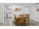 Cozy dining area with wood table and four chairs, opens to kitchen at 5328 Ridgewell Ct, Tampa, FL 33624