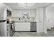 Bright kitchen with stainless steel appliances, ample cabinet space, and granite countertops at 5328 Ridgewell Ct, Tampa, FL 33624