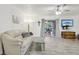 Light-filled living room, featuring gray flooring and neutral decor at 5328 Ridgewell Ct, Tampa, FL 33624