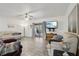 Bright living room with light gray flooring, ceiling fan, slider to patio and comfortable seating at 5328 Ridgewell Ct, Tampa, FL 33624