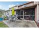 Private patio with table, chairs, and umbrella at 5328 Ridgewell Ct, Tampa, FL 33624