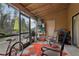 Cozy screened porch with seating and storage at 5328 Ridgewell Ct, Tampa, FL 33624