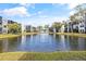 Tranquil lakefront view of condo community at 5980 Terrace Park N Dr # 203, St Petersburg, FL 33709