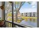 Lovely waterfront view of community pool and lake from balcony at 5980 Terrace Park N Dr # 203, St Petersburg, FL 33709