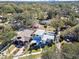 An aerial view of a modern home nestled among lush greenery, offering privacy and a serene neighborhood setting at 6205 River Ter, Tampa, FL 33604