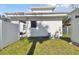 A view of the side and rear of the house with the white privacy fence at 6205 River Ter, Tampa, FL 33604