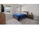 Spacious bedroom with a dresser and a comfortable bed at 6314 Roadstead Ct, Apollo Beach, FL 33572