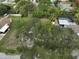 Property is surrounded by lush trees and other homes at 723 Ornelda Sw St, Ruskin, FL 33570
