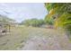 Spacious backyard with a wooden fence and large grassy area at 723 Ornelda Sw St, Ruskin, FL 33570