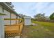 Fenced backyard with shed and open grassy area at 723 Ornelda Sw St, Ruskin, FL 33570