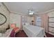 Charming bedroom with floral wallpaper and a ceiling fan at 723 Ornelda Sw St, Ruskin, FL 33570