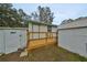 Wooden deck with access to the backyard and storage building at 723 Ornelda Sw St, Ruskin, FL 33570