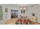 Spacious dining area featuring a round glass table and red chairs at 723 Ornelda Sw St, Ruskin, FL 33570
