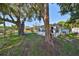 House nestled amongst large shade trees at 723 Ornelda Sw St, Ruskin, FL 33570