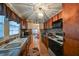 Clean kitchen featuring wood cabinets, a stove, and a microwave at 723 Ornelda Sw St, Ruskin, FL 33570