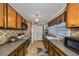 Well-equipped kitchen with wood cabinets and modern appliances at 723 Ornelda Sw St, Ruskin, FL 33570